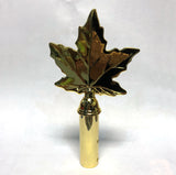 Maple leaf finial in gold colour finish.